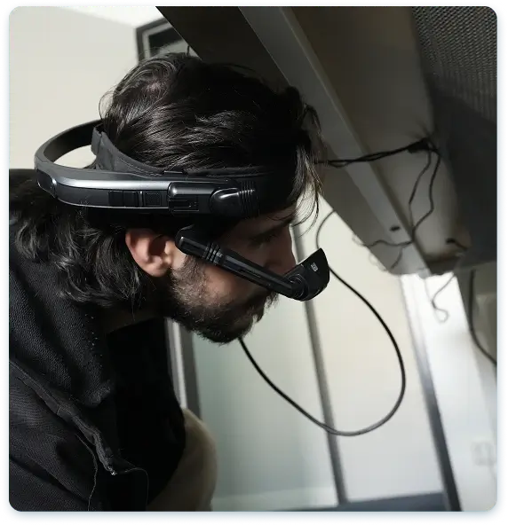 A technician wearing Osra+ augmented reality glasses on site